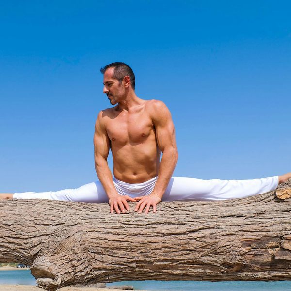 Man performing a controlled strength exercise in a calm environment.
